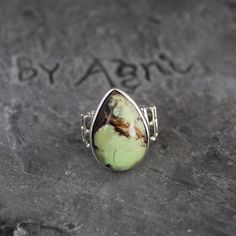 Lemon Chrysoprase Ring, Sterling Silver Ring, Lemon Chrysoprase Gemstone Jewelry For Mom, Chrysoprase Handmade Teardrop Stone Ring For Her Chrysoprase helps one to overcome compulsive or impulsive angry thoughts and behaviour, and turns your attention to positive events. Chrysoprase is a strong detoxifying stone. It is excellent for relaxation and promoting a peaceful night's sleep. This listing is for the following 1 (ONE) ring: ✦Gemstone :        Lemon Chrysoprase *may contain natural inclusions  ✦Stone Shape :    Pear Cabochon ✦Metal:                 925 Sterling Silver Dear customer you will receive the same piece or identical as shown in the picture. Since all gemstones are different from each other, I cannot guarantee the availability of the gemstone shown in the picture, but can gua Adjustable Green Opal Bohemian Ring, Green Bohemian Opal Ring, Green Adjustable Bohemian Opal Ring, Bohemian Green Chrysoprase Ring, Bohemian Green Opal Ring, Unique Adjustable Green Opal Ring, Handmade Green Chrysoprase Ring, Handmade Green Opal Bohemian Ring, Bohemian Green Rings With Natural Stones