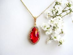 "Ruby Glass Pendant - Czech Stone Detailed - Polished Gold Plated  Ruby Glass Pendant Color = Ruby , Polished Gold Frame Material = Glass, Brass, Czech Stone Size = 14mm x 26mm  16 inches with14k gold filled chain. you may choose any length up to 20\". (NO EXTRA COST) Please leave a note at checkout to specify an alternative length   Earrings https://www.etsy.com/listing/166124003/ruby-red-cubic-gold-earrings?ref=shop_home_active&ga_search_query=ruby%2Bearrings   ♥ ♥ ♥ ♥ ♥ ♥ ♥ ♥ ♥ ♥ ♥ ♥ ♥ ♥ ♥ ♥ Gift Pear-shaped Birthstone Jewelry, Crystal Jewelry For Wedding And Valentine's Day, Red Crystal Bridal Necklace Gift, Gemstone Pendant Bridal Necklace As Gift, Red Crystal Bridal Necklace For Gifts, Red Cubic Zirconia Jewelry For Mother's Day, Mother's Day Red Cubic Zirconia Jewelry, Crystal Jewelry Sets For Gifts, Formal Gemstone Jewelry For Mother's Day