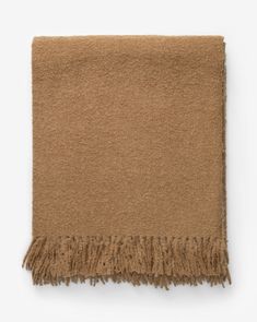 a brown scarf with fringes on it