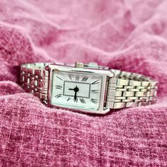 Woman Wrist Watch, Silver Colour Watch, Roman Numeral Dial, Rectangle Design Watch, Modern Design Watch, Adjustable Band, White Dail, Gift for Her, Mother's Day Gift, Valentine's Day Gift, Present for Her, Daily Usage, Christmas Gift Diamensions: - Case Thickness: 9 mm - Total Lenght: 22,5 cm - Case Diameter: 25 mm x 20 mm - Weight: 45 gr Classic Square Watch As A Gift, Classic Square Watch As Gift, Classic Square Watch For Gifts, Classic Square Watch For Gift, Classic Square Watch Accessories For Gifts, Timeless Watch Accessories For Gift, Classic Silver Rectangular Watch Accessories, Timeless Rectangular Bracelet Strap Watch Band, Silver Classic Rectangular Watch Bands