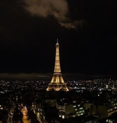 the eiffel tower lit up at night in paris, france as seen from above