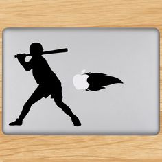 a laptop sticker with a silhouette of a person holding a tennis racquet