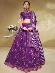 Make everyone's head turn with the enchanting purple embroidered silk wedding lehenga choli with dupatta. This stunning ensemble is crafted from high-quality art silk material, featuring a rich purple color that exudes elegance and sophistication. The lehenga showcases exquisite thread embroidered work, adding a touch of intricate detail to the overall design.
The set includes a matching choli, also made from a similar color art silk material, with thread embroidered work that perfectly compleme Purple Chanderi Anarkali Set For Reception, Purple Silk Sharara For Navratri, Purple Chanderi Sharara For Reception, Purple Floor-length Traditional Wear For Navratri, Purple Silk Sets For Reception, Purple Chanderi Lehenga For Reception, Purple Silk Lehenga For Reception, Purple Chanderi Sharara With Pallu, Purple Chanderi Traditional Wear For Reception