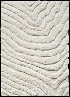 a white rug with wavy lines on it