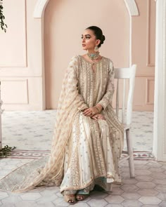 Buy Embellished Sharara Kameez Pakistani Wedding Dress, adorned with embroidery work, stones, sequins, motifs, and adda work. Custom sizes. Fast shipping. White And Gold Pakistani Dress, Elegant Jamawar Salwar Kameez For Wedding, Elegant Jamawar Sharara For Wedding, Elegant Jamawar Lawn Suit For Wedding, Unstitched Jamawar Suit With Intricate Embroidery For Reception, Jamawar Unstitched Suit With Intricate Embroidery For Reception, Elegant Jamawar Salwar Kameez For Reception, Anarkali Lawn Suit For Wedding With Traditional Drape, Unstitched Wedding Sharara With Intricate Embroidery