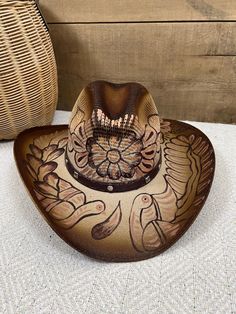 Beautiful hand painted hat, crafted by Artisans in Mexico. This hand made sombrero was made of jute. Perfect to add that special touch to any outfit. SIZE: One size fits most, this hat is medium size Thank you for visiting my store and have a wonderful day! Adjustable Hand Painted Fedora For Country Events, Artistic Adjustable Straw Hat For Festivals, Hand Painted Hats With Curved Brim For Country Events, Hand Painted Adjustable Fedora For Country Events, Artistic Wide Brim Hat For Rodeo, Artistic Wide Brim Adjustable Straw Hat, Artistic Adjustable Hat For Rodeo, Artisan Brown Straw Hat For Country Events, Hand Painted Adjustable Straw Hat With Short Brim