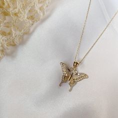 Give her the gift of wings with this beautiful butterfly necklace. DETAILS - 14k yellow gold butterfly with rhodium plating - Chain option is a 14k yellow gold cable chain - Chain style may vary slightly - Approximately 13/16 inch wide x 7/8 inch tall (including bail) VARIATIONS If you require any variation of this style (a different style chain, longer chain, etc.) feel free to message us. We will do our best to accommodate you. Additional costs may apply depending on the variation. POLICY We d Dainty Yellow Gold Butterfly Pendant Necklace, 14k Yellow Gold Butterfly Pendant Necklace, 14k Yellow Gold Necklace With Butterfly Charm, Dainty Gold-plated Yellow Gold Butterfly Necklace, Delicate Yellow Gold Butterfly Pendant Necklace, Dainty Yellow Gold Butterfly Jewelry, Dainty Butterfly Yellow Gold Jewelry, Dainty 14k Gold Butterfly Jewelry, Dainty 14k Yellow Gold Butterfly Necklace