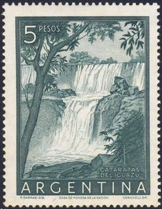 a stamp with a waterfall and trees on it