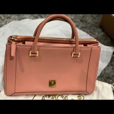 Authentic Mcm Pink Satchel Bag Saffiano Leather. Only Flaws Is Hairline Scratch In Front And Back Of The Bag. Please See Pictures. Classic Pink Bag For Business, Classic Pink Business Bag, Elegant Pink Business Bag, Elegant Pink Business Bags, Pink Satchel For Business, Chic Pink Business Shoulder Bag, Formal Pink Epsom Leather Bag, Designer Pink Satchel For Office, Elegant Pink Epsom Leather Bag