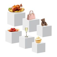 there is a turkey, cupcakes, and other foods on the white blocks