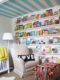 there are pictures of children's books on the wall and in the room,