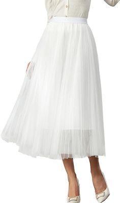 Look your best in the Prestigious Tulle Pleated Flowy Maxi Skirt. This lightweight and comfortable skirt is crafted from soft tulle that is pleated for maximum comfort. Its flowy skirt design adds a touch of class and elegance to your wardrobe. Perfect for formal occasions or everyday wear. 100% Polyester Imported Elegant pleated design: This pleated skirt features a beautiful pleated design that creates a flowing, elegant silhouette. The pleats are evenly spaced and give the skirt a luxurious t Elegant Tulle Flared Maxi Skirt, Elegant Flared Tulle Maxi Skirt, Pleated Tulle Party Bottoms, Elegant Tulle Lined Maxi Skirt, Flowy Party Maxi Skirt With Pleated Hem, Summer Flowy Tulle Pleated Skirt, Elegant Tiered Tulle Pleated Skirt, Elegant Pleated Tiered Tulle Skirt, Elegant Full Skirt Tulle Bottoms