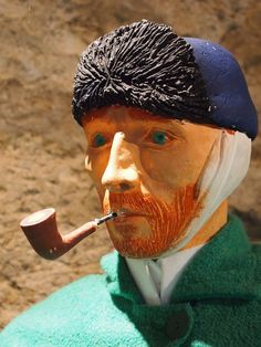 a statue of a man with a pipe in his mouth