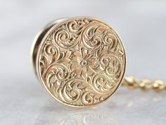 This handsome gold tie tack from the early 1900s features a hand engraved floral motif on the front that is quite lovely. Crafted of 14 karat yellow gold, this is a great piece for either sex, perfectly polished and ready to wear or gift! Metal: 14K Yellow Gold Measures: 12 x 17 mm Marks: "14K" Stamped on the reverse Antique Gold Engraved Adjustable Necklace, Adjustable Antique Gold Engraved Jewelry, Antique Flower Engraved Jewelry, Antique Engraved Gold-plated Jewelry, Antique Engraved Gold-tone Jewelry, Gold Tie, Tie Tack, Tie Accessories, Hand Engraving