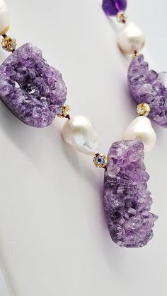 One-of-a-Kind The kind of necklace that makes your heart beat faster, three beautiful richly veined amethyst geodes with polished back, center a striking necklace of elegant Baroque Pearls mixed with polished Amethyst 16mm beads. Spacers are vermeil and c.z mini beads. The clasp is Vermeil and Amethyst. Silk hand-knotted Approx: 18 inches Luxury Handmade Amethyst Beaded Necklaces, Luxury Elegant Amethyst Beaded Necklaces, Luxury Amethyst Necklace With Large Pendant, Luxury Amethyst Multi-stone Necklaces, High-end Faceted Amethyst Necklaces, Heart Beating Fast, Woman Jewelry, Baroque Pearl Necklace, Amethyst Geode