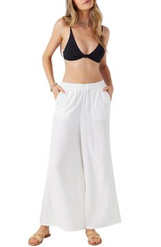 Crinkled double cotton gauze feels cool and airy against your skin in these pants with a comfortable elastic waist and flowy wide-leg silhoutte. Elastic waist Front slant pockets 100% cotton Machine wash, tumble dry Imported White Breezy Loungewear Bottoms, Breezy White Loungewear Bottoms, Breezy White Bottoms With Relaxed Fit, Beach Season Wide Leg Harem Pants With Elastic Waistband, Cotton Wide Leg Pants For Beach Season, Wide Leg Harem Pants With Elastic Waistband For Beach, White Relaxed Wide Leg Pants With Elastic Waistband, Breezy White Wide Leg Bottoms, White Breezy Wide Leg Bottoms