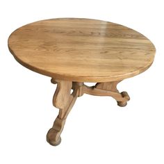 a round wooden table with four legs