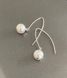 "Large white Swarovski crystal pearl drop dangle arc earrings are available in gold filled or sterling silver. Lightweight, minimalist & modern. A great addition to any outfit dressed up or down, day to evening. They go with everything.  The earrings are appox 1.5\" from end to end.   You may also like to check out more of my pearl jewelry and June birthstone gift ideas here: https://etsy.me/3olEKFI You may also like to check out more of my earrings here: http://etsy.me/2oDJlWy Free first class USPS shipping within the USA." Jewelry Words, Best Gifts For Her, June Birthstone, Pearl Earrings Dangle, Threader Earrings, Swarovski Pearls, Gold Earrings Dangle, June Birth Stone, Crystal Pearls