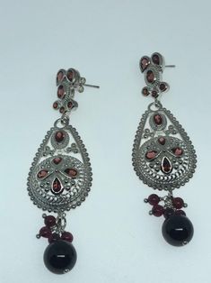 Vintage 925 Sterling Silver Bohemian Garnet dangle Chandelier Earrings Lovely handmade silver work About 2.5 inch 92.5% Sterling Silver All jewelry is shipped free in the US in a nice gift box. Check out our over a THOUSAND great reviews Sterling Silver Festive Drop Chandelier Earrings, Sterling Silver Festive Dangle Chandelier Earrings, Sterling Silver Dangle Chandelier Earrings For Festive Occasions, Traditional Silver Drop Jewelry, Silver Pierced Chandelier Earrings For Festive Occasion, Silver Dangle Danglers, Ornate Sterling Silver Danglers, Traditional Silver Dangle Chandelier Earrings, Ornate Sterling Silver Chandelier Earrings