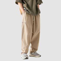 Material: 100% PolyesterFeatures: Pants, cargo pants, wide legs, slightly stretchy, drawstring waist, solid color, straight-leg, relaxed fit, unisex, couple outfits.Style: Casual, college, streetwear College Streetwear, Pants Cargo, Couple Outfits, Wide Legs, Pocket Design, Drawstring Waist, Cargo Pants, Zipper Pocket, Style Casual