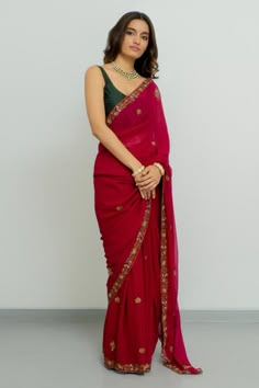 Rani pink georgette saree with zardosi hand embroidered borders. Comes with a raw silk blouse.
Components: 2
Pattern: Hand embroidered
Type Of Work: Zardosi
Neckline: Round
Sleeve Type: Sleeveless
Fabric: Saree : Georgette, Blouse : Raw silk
Color: Pink
Other Details: 
Disclaimer : The product will dispose off some color, since it is hand dyed.
Occasion: Wedding - Aza Fashions Elegant Fitted Saree For Puja, Zardosi Saree, Latest Saree Blouse, Saree Georgette, Saree Blouse Styles, Simple Saree Designs, Rani Pink, Lehenga Designs Simple, Fancy Sarees Party Wear