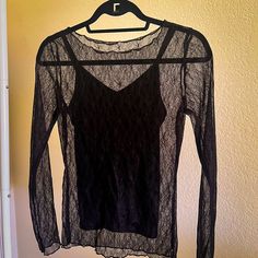 Never Worn Black Long Sleeve Lace Top Over Attached Black Camisole. Size Small Purchased From Vici. Brand Is Wishlist. Black Lace Top With Spaghetti Straps For Party, Party Lace Cami Top, Sheer Spaghetti Strap Tops For Party, Stretch Lace Top Camisole For Night Out, Sheer Stretch Tops With Spaghetti Straps, Stretch Sheer Spaghetti Strap Tops, Black Camisole Blouse For Night Out, Black Lace Top With Spaghetti Straps For Spring, Sheer Stretch Camisole For Night Out