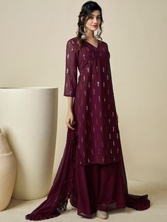 Burgundy embroidered Kurta with Palazzos with dupattaKurta design:Ethnic motifs embroideredA-line shapeRegular styleV-neck, three-quarter regular sleevesNa pockets sequinned detailKnee length length with straight hemGeorgette machine weave fabricPalazzos design:Solid PalazzosPartially elasticated waistbandSlip-on closure Festive V-neck Lehenga With Dupatta, V-neck Anarkali Set For Diwali, Georgette V-neck Sets For Navratri, V-neck Georgette Sets For Navratri, V-neck Lehenga With Resham Embroidery For Diwali, Diwali Lehenga With Resham Embroidery And V-neck, Designer V-neck Lehenga For Festivals, Eid V-neck Sets With Zari Work, Festive Chanderi Salwar Kameez With V-neck