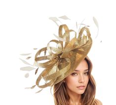 Hats By Cressida Kentucky Derby & Ascot Fascinator Hats Metallic Gold Million Dollar Sinamay & Feather Disc Fascinator Hat Beautiful metallic gold sinamay loops with gold and cream feathers on a sinamay base Fascinator body measures about 12 Inches wide Mounted with a matching headband. If you prefer a headband to match your hair, please make a note at check out what colour headband you want. Make a statement at the upcoming Kentucky Derby, Royal Ascot or Ladies Day event with our Million Dollar Fascinator Hat! Perfect for weddings, races, or any formal occasion, this Saucer Disc hat is a stunning addition to any outfit. Be the envy of all other guests with this eye-catching headwear, whether you're the mother of the bride or a wedding guest. Elevate your style with this unique hatinator a Gold Costume Hats For Spring Wedding, Gold Costume Hats And Headpieces For Spring Wedding, Gold Short Brim Fascinator For Summer, Gold Curved Brim Fascinator For Spring, Gold Wide Brim Fascinator For Summer, Gold Short Brim Summer Fascinator, Fitted Beige Costume Hats And Headpieces For Party, Adjustable Beige Costume Hats For Party, Beige Fitted Top Hat For Party