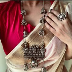 With the significant Indian festivals just around the corner, style up your game with these exquisite sets of oxidized German silver Indian jewelry. Pair the Indian jewelry set with a simple flowy saree or a casual shirt to turn up the style quotient. This beautiful set of oxidized jewelry comes with a pair of matching exquisite earrings set, ring, and a long chain necklace, all of which features playful jhumkis and ghungroo to make your appearance bold and playful. Try out this Indian jewelry t Luxury Oxidized Temple Necklace For Rituals, Oxidized Finish Necklace For Festivals, Matte Gold Necklace, Silver Indian Jewelry, Indian Jewelry Set, Traditional Boho, Beautiful Personality, Hand Cuff Bracelet, Oxidised Silver Jewelry