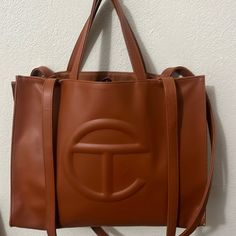 Medium Tan Telfar Bag; Like New. Still Have The Storage Bag. Luxury Large Capacity Tan Shoulder Bag, Designer Tan Bags With Detachable Handle, Designer Tan Bag With Detachable Handle, Designer Tan Satchel Bag, Rectangular Tan Shoulder Bag With Dust Bag, Tan Rectangular Shoulder Bag With Dust Bag, Designer Tan Bags For On-the-go, Rectangular Tan Bags For On-the-go, Designer Tan Crossbody Bag