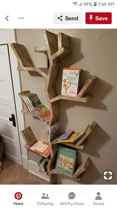 a wooden tree shelf with books on it