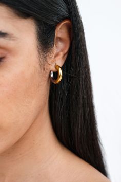 Introducing our Emery Two-Toned Hoops. A harmonious pairing of gold and silver tones brings a contemporary touch to these perfectly-chunky minimalist hoop earrings that are 18KT yellow gold-plated. Streamlined and understated, they're crafted for effortless, elegant daily wear. Each pair includes a Marcella-branded vegan leather travel case for safe storage and easy travel. | Available in one size. Approximately .75” (19 mm). Stainless steel. 18KT yellow gold plated. For long-lasting quality, av Modern Polished Hoop Earrings For Everyday, Modern Tarnish-resistant Huggie Earrings For Everyday, Trendy Gold Earrings For Work, Minimalist Polished Hoop Earrings For Everyday, Sleek Gold Earrings For Everyday Wear, Sleek Small Hoop Jewelry For Everyday, Sleek Small Hoop Earrings For Everyday, Sleek Small Hoop Everyday Jewelry, Minimalist Hoop Earrings With Polished Finish