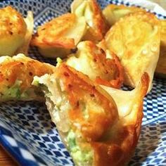 some food is sitting on a blue and white plate with holes in the middle that have been cut into small pieces