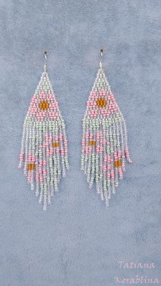 These handmade author's earrings are made of high-quality Czech beads and strong synthetic thread.In these unique earrings I use my author's scheme Vitrage flowers (Stained glass flowers) . Color: clear, mint, pink,orange. I will make these earrings for you in your color. I beg you not to copy my authoring 100% hand made with love! Measurements: Length with hook - near 11 cm( 4,33 inch ),Width -3 cm (1.18 inch) Materials: Silver plated ear hooks Czech glass beads Tytan Thread Whimsical Pink Beaded Earrings, Bohemian Beaded Pastel Jewelry, Handmade Whimsical Beaded Drop Earrings, Handmade Whimsical Multicolor Beaded Earrings, Whimsical Handmade Beaded Drop Earrings, Whimsical Handmade Multicolor Beaded Earrings, Whimsical Multicolor Handmade Beaded Earrings, Handmade Pink Dangle Flower Earrings, Handmade Bohemian Pink Flower Earrings