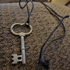 an old key is laying on the ground