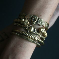 WE ARE CURRENTLY SHIPPING ALL OUR ORDERS VIA DHL EXPRESS TO MAKE SURE THAT YOUR ORDERS ARE DELIVERED SUPER SAFE AND SUPER FAST! *MAKE SURE TO INCLUDE YOUR PHONE NUMBER IN THE 'NOTE TO SELLER' FIELD AT CHECKOUT ! Handcrafted solid yellow bronze open back engraved cuff with intricate designs inspired by nature. Features two snake heads at the back which makes it equally perfect to wear that side on top. The metal has been oxidized and engraved for an antique look then polished for a beautiful burn Ceremonial Gold Brass Cuff Bracelet, Heirloom Brass Gold Bracelets, Heirloom Gold Brass Bracelets, Antique Gold Bracelet With Antique Finish, Vintage Gold Etched Cuff Bracelet, Adjustable Gold Victorian Cuff Bracelet, Ornate Brass Bracelets With Antique Finish, Antique Finish Brass Gold Bracelet, Antique Bronze Brass Cuff Bracelet