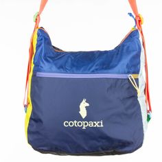 a blue bag with the word cotopaxi printed on it's side