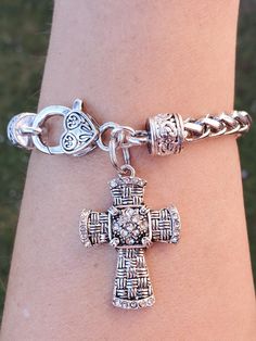 Pretty crystal cross bracelet  the cross is made of Antique silver plated, lead~free, nickel~free, cadmium~free   Stainless steel braided bracelet fitting up to an 8" wrist  Quantity: 1 Bracelet as shown     Thank you for visiting my shop! Silver Cross Bracelet, Spiritual Style, Spiritual Silver Cross Bracelet, Nickel Free Silver Cross Bracelets, Nickel-free Silver Cross Rosary Bracelet, Silver Cross Rosary Bracelet, Nickel-free Silver Cross Bracelets, Spiritual Silver Charm Bracelet With Cross, Spiritual Silver Cross Charm Bracelet, Silver Nickel-free Cross Bracelet