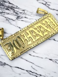 "●  10K 14K Solid Real Gold Customized Name Pendant Necklace in Frame Letter Diamond Cut Jewelry Personalized Gift For Him and Her   ●Necklace is not included, need to buy separately. ●Metal : 10K or 14K Solid Gold ●Purity : 10K or 14K with authenticity stamp ●Made in : United States ● Cut Type: Diamond Cut ●Shape :BLOCK or any customized shape as per your request. ● Fonts: Please specify fonts while placing your order, or we will do OLD ENGLISH fonts as shown in the image and video. ●Weight: Ap Custom 14k Gold Nameplate Necklace, Custom Engraved Gold Plated Nameplate Necklace, Formal Engraved Nameplate Necklace, Formal Custom Engraved Nameplate Necklace, Gold Rectangular Pendant Jewelry Stamped 14k, Luxury Gold Nameplate Necklace, 14k Gold Tarnish Resistant Custom Necklace, Luxury Nameplate Necklace For Formal Occasions, Personalized Nameplate Jewelry With Polished Finish