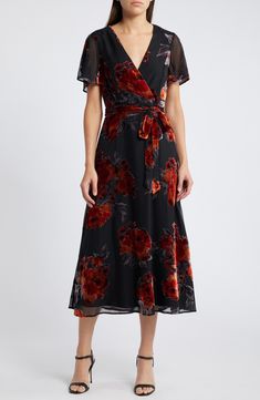 For slimming style and a flattering fit, this faux-wrap dress is an easy winner in the wardrobe game. 49 1/2" length Hidden back zip; keyhole with button-and-loop closure Surplice V-neck Short sleeves Removable tie belt Lined 100% polyester Hand wash, line dry Imported Floral Wrap Dress Midi, Velvet Floral Dress, Wedding Guest Dress For Fall, Dark Floral Dress, Burnout Velvet Dress, Velvet Tie, Wedding Guest Attire, Midi Dress Formal, Black Floral Dress