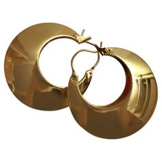 Vintage Gold Tone Hoop Earrings Circa 1980s. These are the earrings that you didn't know you needed until you try them on. They are not giant in size but giant in punch. Very chic. They are so special. Well made. They are hollow on the inside but puff out to give the illusion of a very full earring. A very good size as you can wear them for day or for evening. Pierced. Retro Gold Round Hoop Earrings, Gold Retro Round Hoop Earrings, Jewelry Earrings Hoops, Gold Hoop, Gold Hoop Earrings, Vintage Gold, Hinges, Gold Tones, Hoop Earrings