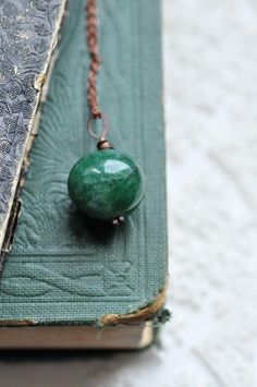 This listing is for elegant Heart of the Forest Necklace. Simple and natural, features beautiful emerald green gemstone.  The rich green color symbolizes growth, renewal, and harmony, perfect for those who embrace a natural and bohemian vibe. The design is simple yet captivating, allowing the deep green gemstone to be the central point. Thanks to this beautiful emerald green gemstone, I decided to call it "Heart of the Forest". With its earthy and enchanting feel, this necklace is ideal for anyone who wants to bring a bit of forest magic into their style. measurements: width of the pendant - 1,1 inches (2,8 cm) measurements: Please choose your chain options - the price for each option is different (please check while adding it to your cart) No chain (just the pendant) 18 inches (46 cm) 25 Dark Green Gemstone Beads Jewelry Gift, Forest Necklace, Forest Magic, Green Jewelry, Simple Green, Necklace Simple, Rich Green, Green Gemstones, Gifts For Nature Lovers