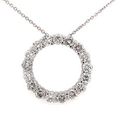 This is our magnificent Circle of Love pendant necklace in 14 kt white gold! This classic circle pendant has an amazing 7.00 ct. total weight of immaculately clean SI-1 clarity and brilliantly white F color diamonds set in a never ending circle on this pendant. A 16 inch cable link chain loops through the hidden bale of the pendant and this secures to the neck with a lobster claw closure. Classic Round Diamond Necklace With Halo Design, Classic Open Circle Necklace For Anniversary, 14k White Gold Round Brilliant Cut Necklace, 14k White Gold Brilliant Cut Necklace, White Halo Diamond Necklace, White Round Halo Diamond Necklace, Anniversary White Gold Circle Diamond Necklace, 14k White Gold Necklace With Prong Setting, 14k White Gold Necklace With Vvs Clarity