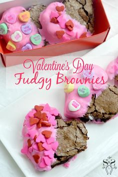 valentine's day fudgey brownies with pink frosting and hearts on them