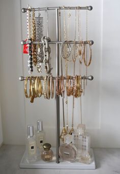 a jewelry rack with bracelets and rings on it