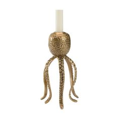 an octopus candle holder is shown on a white background