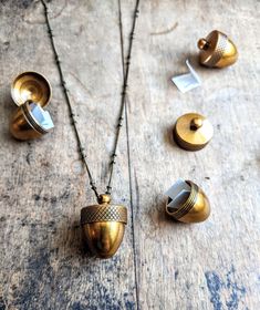 This adorable acorn necklace is made out of antiques brass. These are durable twist off lockets with detailed brushing on the metal, very meticulously done. They're just under an inch in height. Put a note, a lock of hair, a feather, or even some essential oils inside 🌰🍂 The chain is fine yet really durable and made out of solid brass with tiny studs. Chain comes in a variety of different lengths but I show a 24 inch chain in this listing Acorn Jewelry, Witchy Boho, Fruit Necklace, Essential Oil Necklaces, Lock Of Hair, Acorn Necklace, Fruit Jewelry, Tiny Studs, Keepsake Jewelry