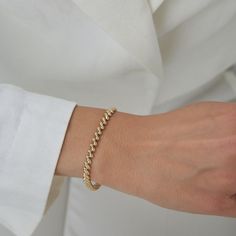 Indulge in the timeless allure of our 14k Gold Oval Box Links Minimalist Fine Jewelry Dainty Bracelet. Crafted with elegance and sophistication in mind, this exquisite piece features a sleek rectangular design that effortlessly exudes modern charm. Handcrafted with meticulous attention to detail, each delicate link showcases the highest quality 14k gold, ensuring both durability and luxury. Its minimalist aesthetic makes it the perfect accessory for any occasion, whether you're dressing up for a Gold Armband, Jewelry Dainty, Dainty Bracelet, Dainty Bracelets, Minimalist Aesthetic, Gold Bracelet, Jewelry Bracelets, Fine Jewelry, Beaded Bracelets