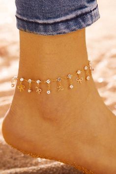 A stylish anklet featuring shimmering diamond beads and a delicate charm decoration of butterflies, this golden accessory can create a bohemian beach look or a punky street look. Size (inches): One size Bohemian Beach, Water Droplets, Street Look, Beach Look, Just For Me, Delicate Bracelet, Anklets, Butterflies, Sandals