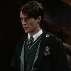 the young harry potter is dressed in his uniform